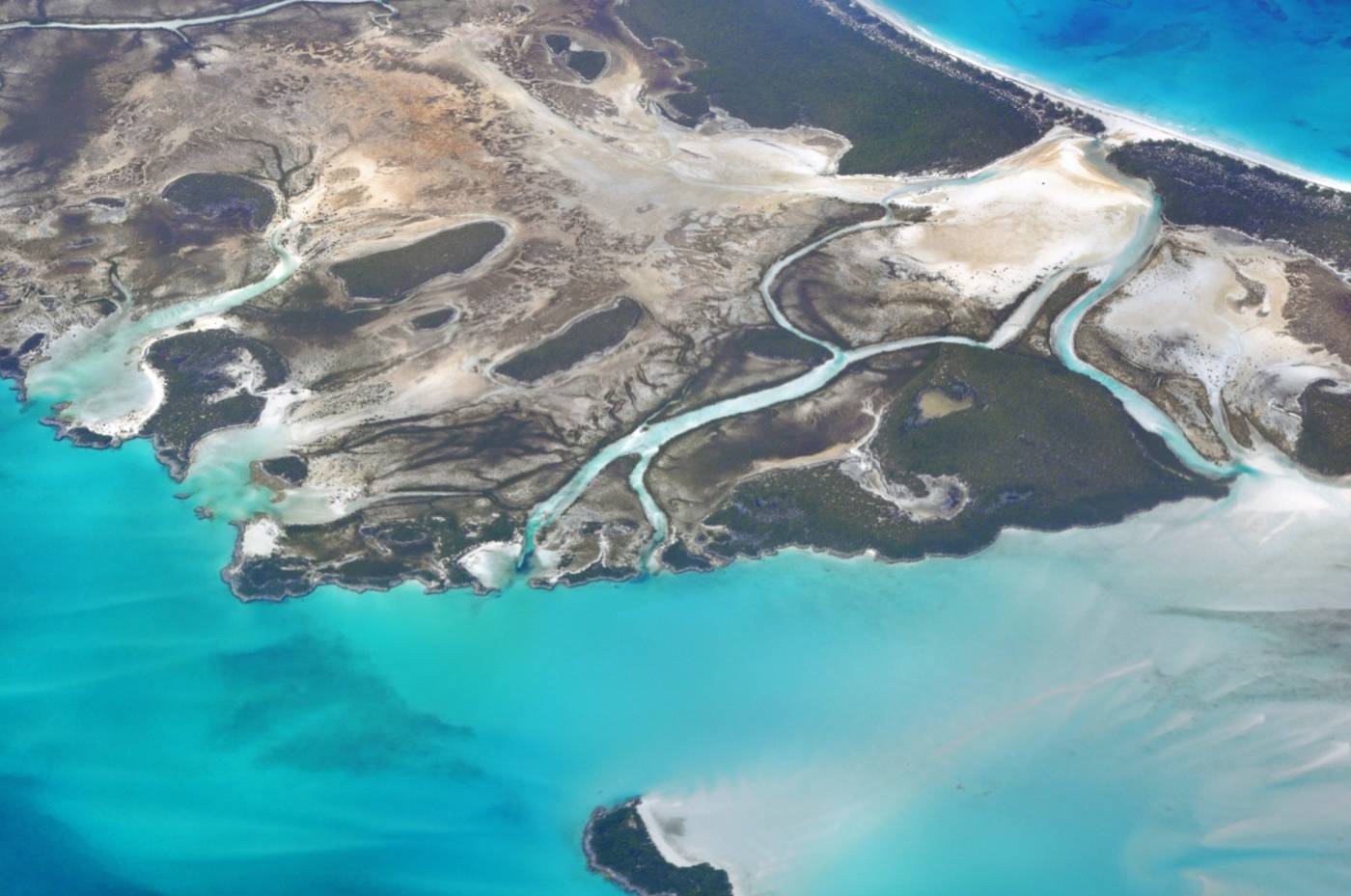 Aerial view of Shroud Cay's mangrove islands and pale tidal creeks running into turquoise water
